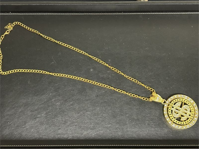 Gold Tone Necklace with Spinner Gold Tone $ Sign Charm